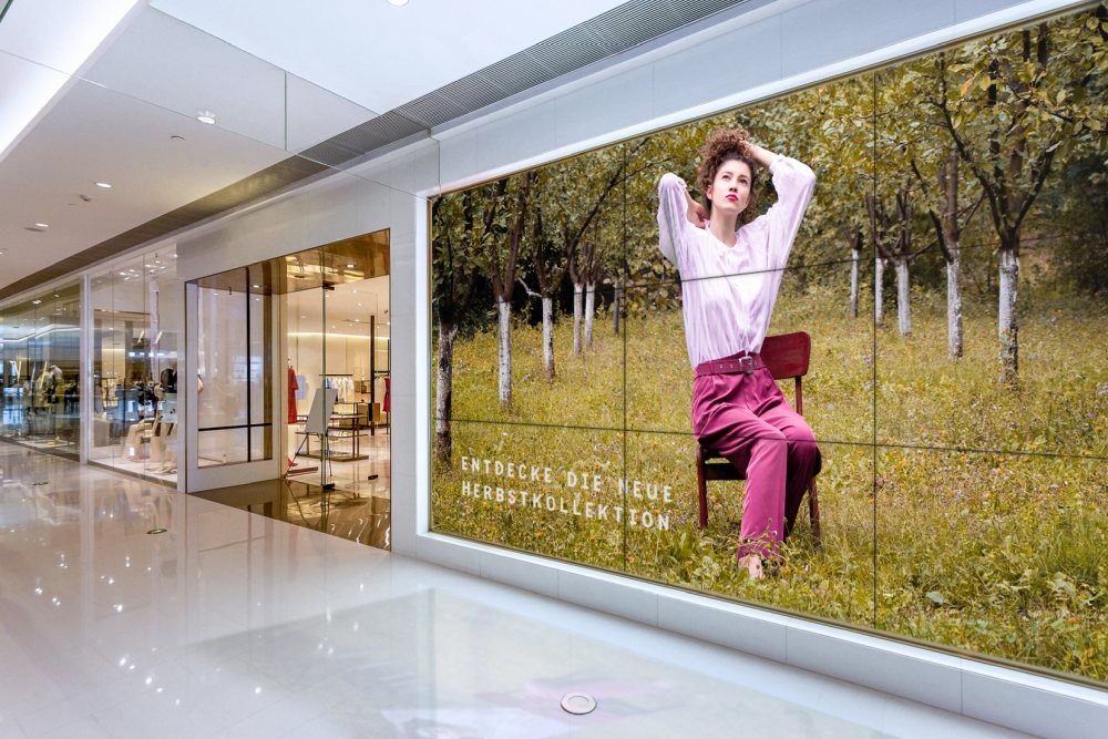 Empty blank billboard in shopping mall interior